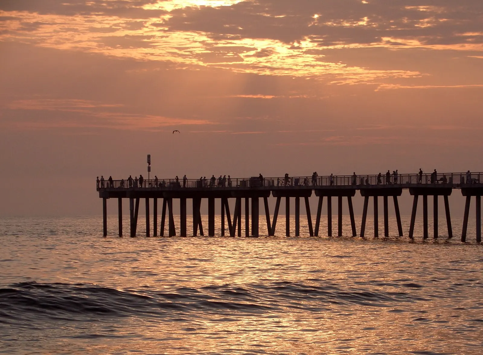 Waves at sunset by Hermosa Beach Pier